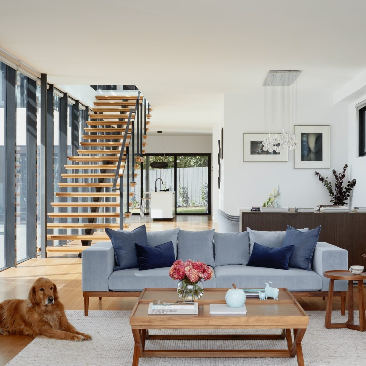 brown wooden coffee table near gray couch