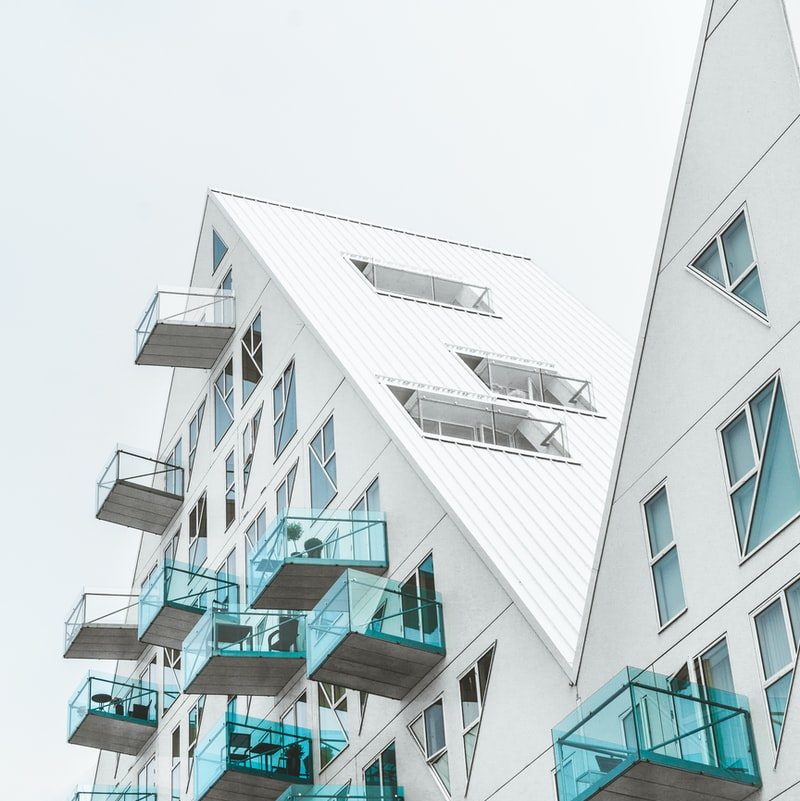 close-up photo of white and teal concrete building